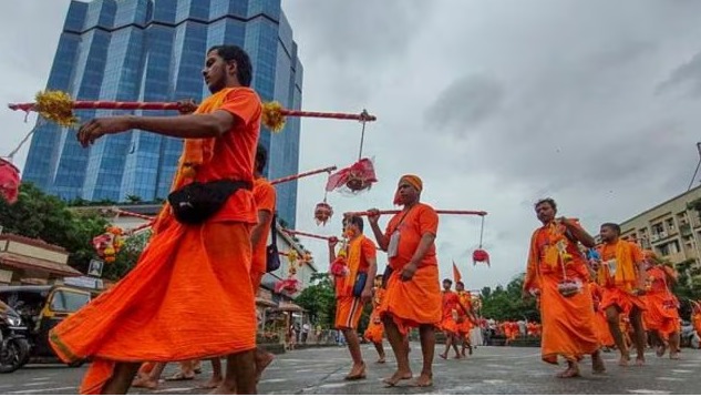 "Kanwariyas lying injured on the road after a tragic accident in Deoghar, Jharkhand during Shrawan Yatra"